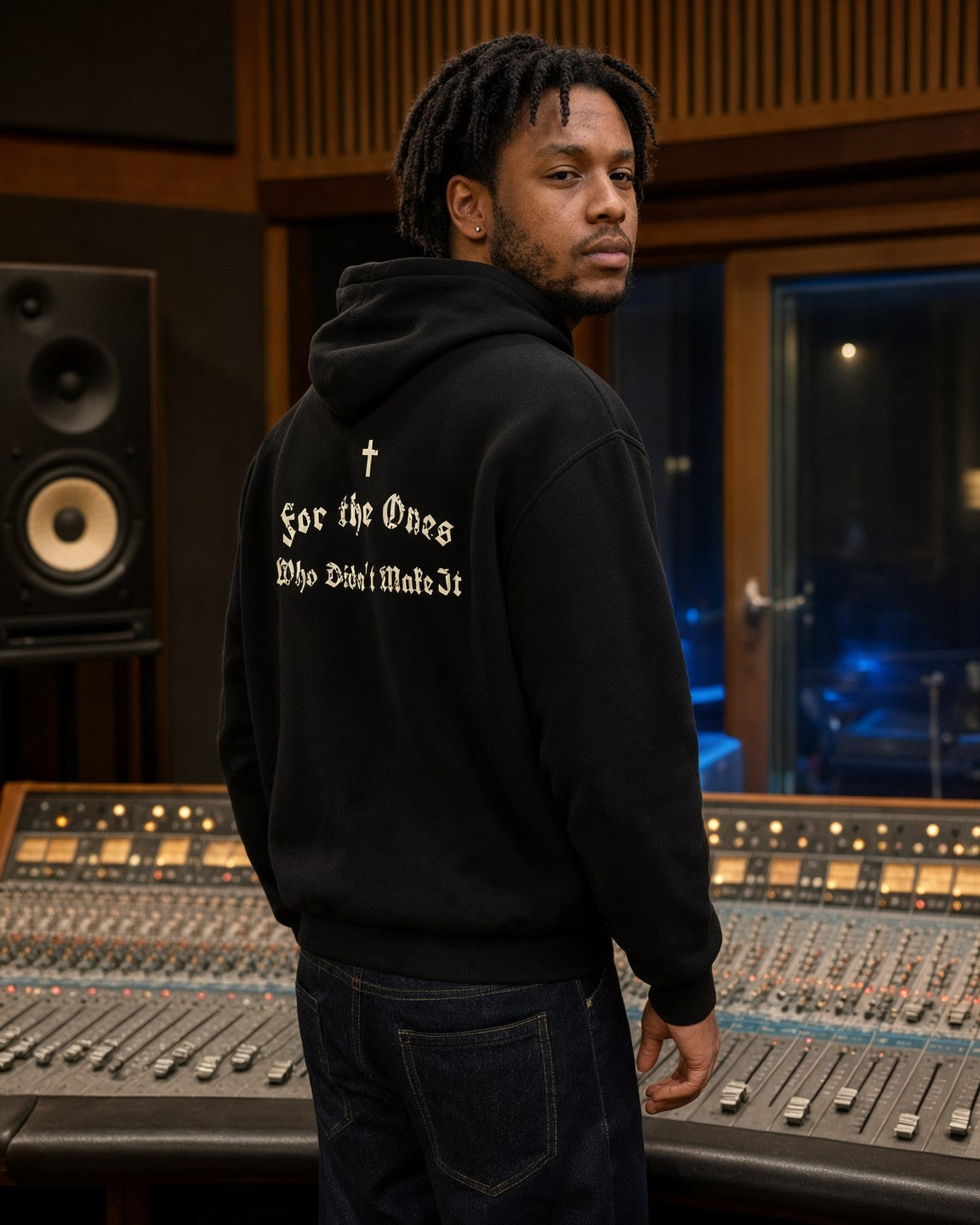 Model wearing the For the Ones Hoodie in Black