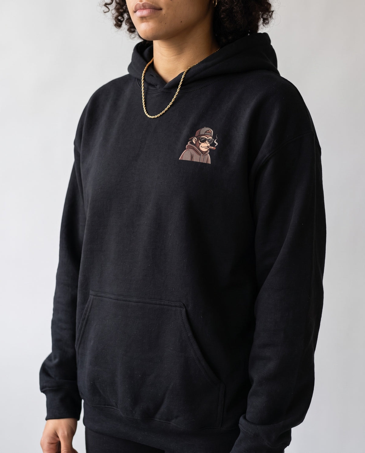Model wearing the Hip Hop Head Hoodie in Black, print close-up