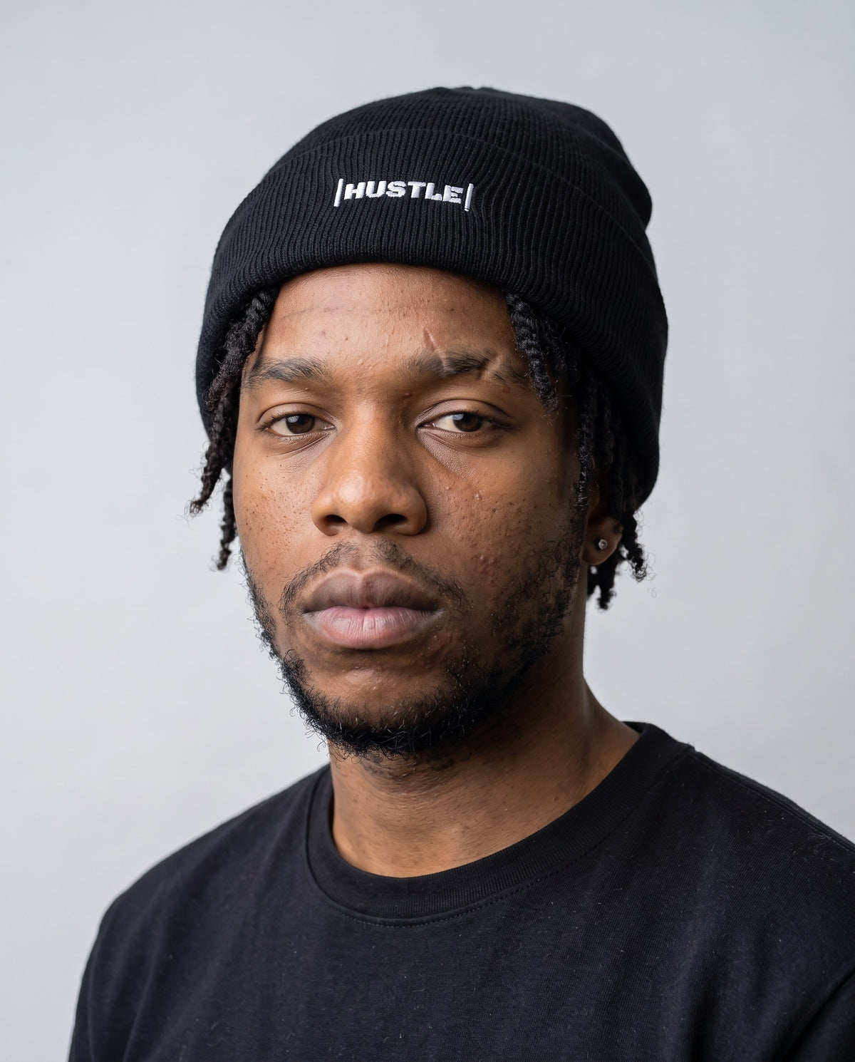Model wearing the Hustle beanie in Black