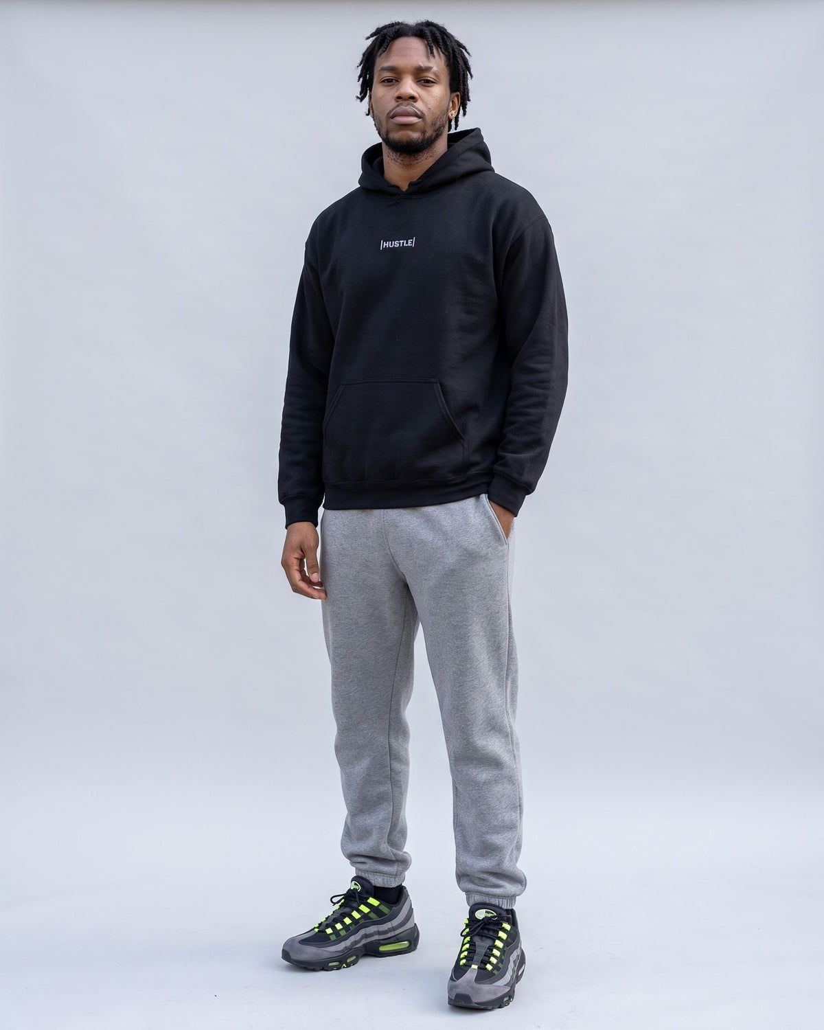 Model wearing the Hustle Hoodie in Black, full length