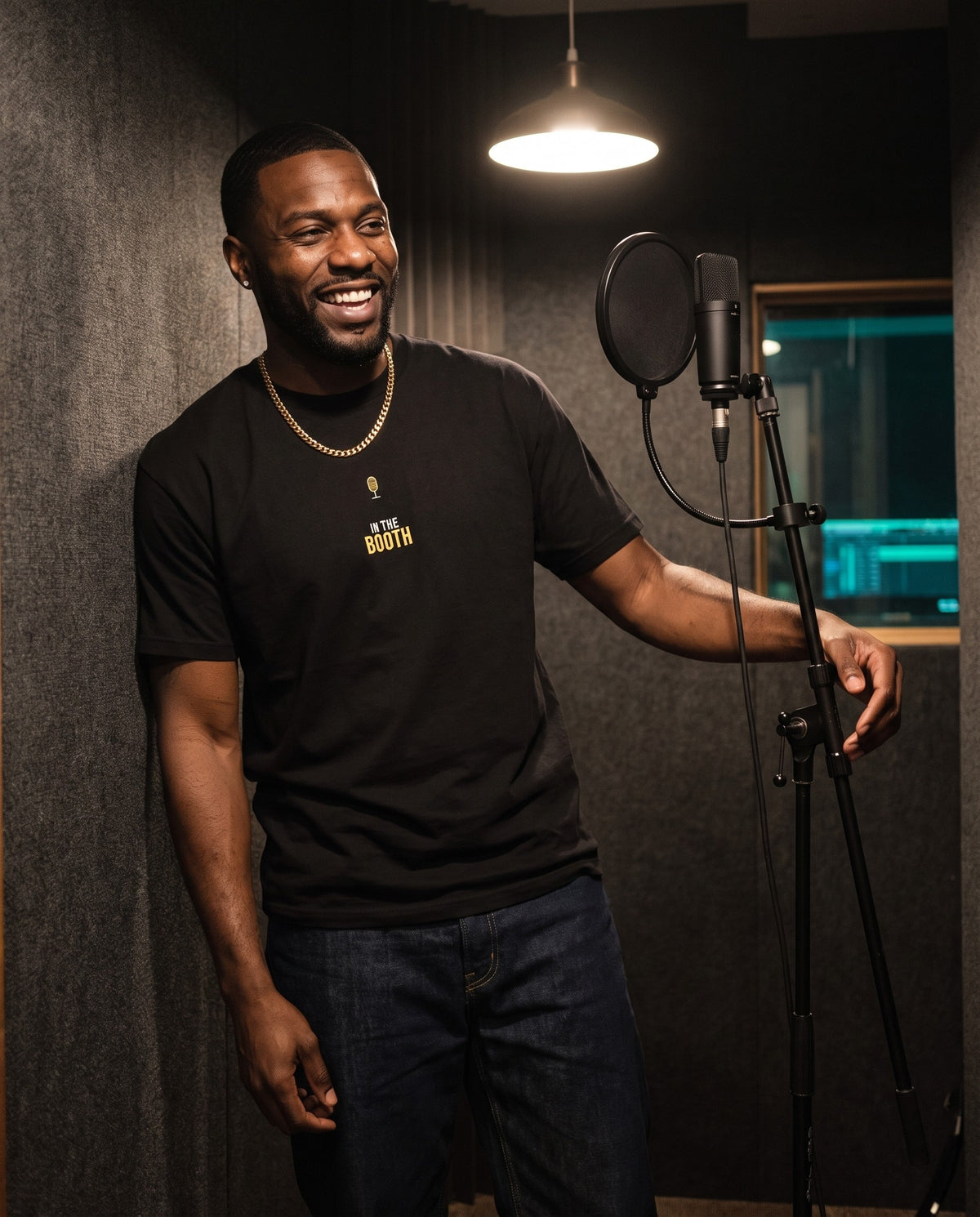 Model wearing the In The Booth t-shirt in Black, in a vocal booth
