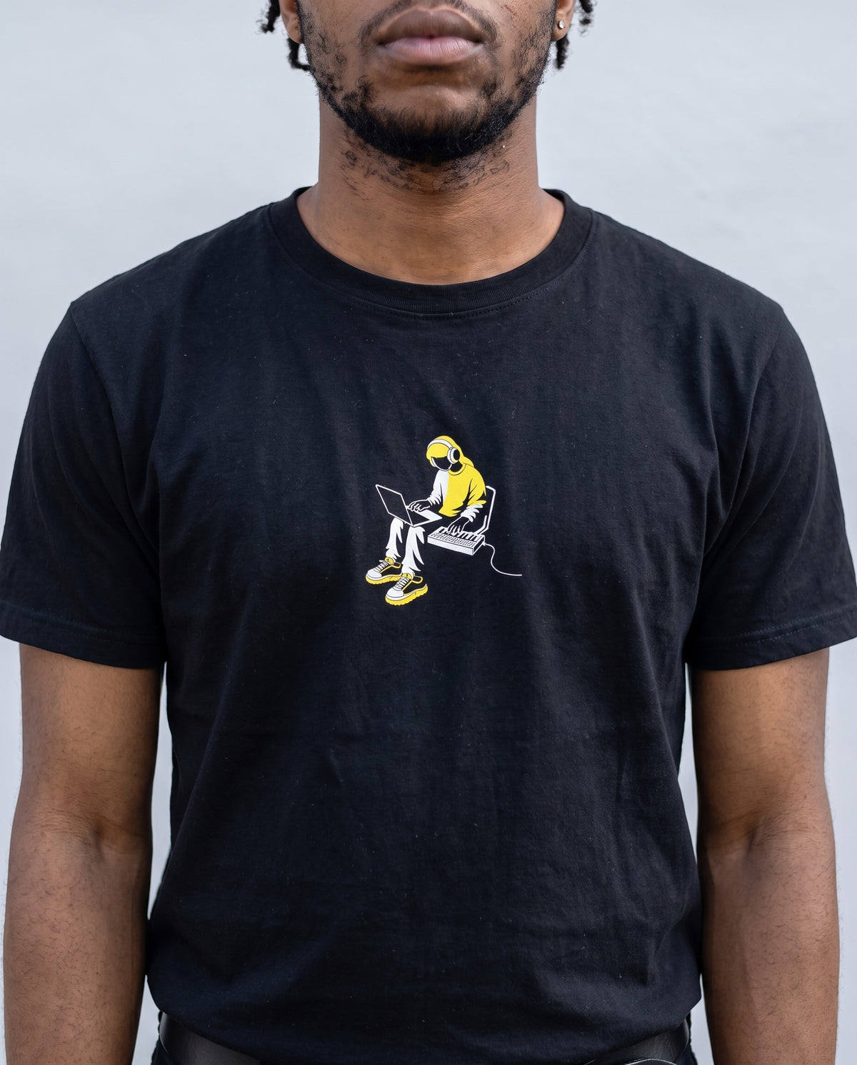 Model wearing the Laptop Producer t-shirt in Black, print close-up