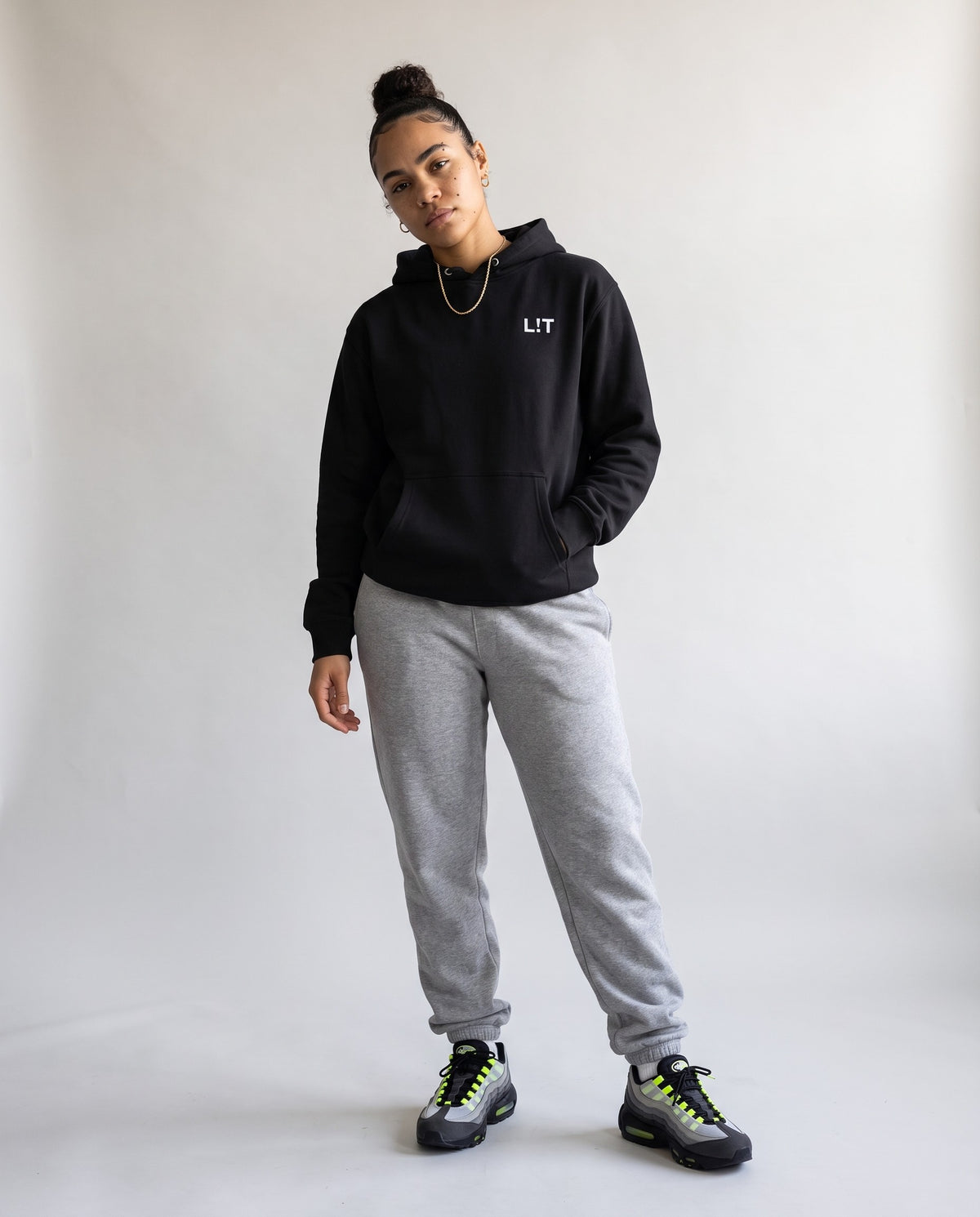 Model wearing the L!T Hoodie in Black, full length