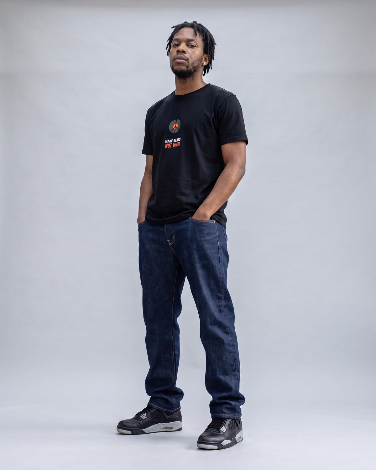 Model wearing the Make Beats Not War t-shirt in Black, full length