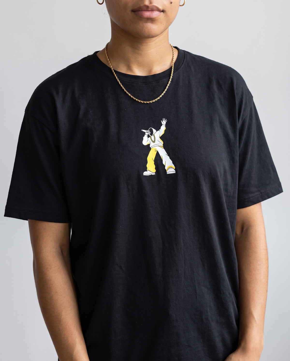 Model wearing the Move The Crowd t-shirt in Black, print close-up