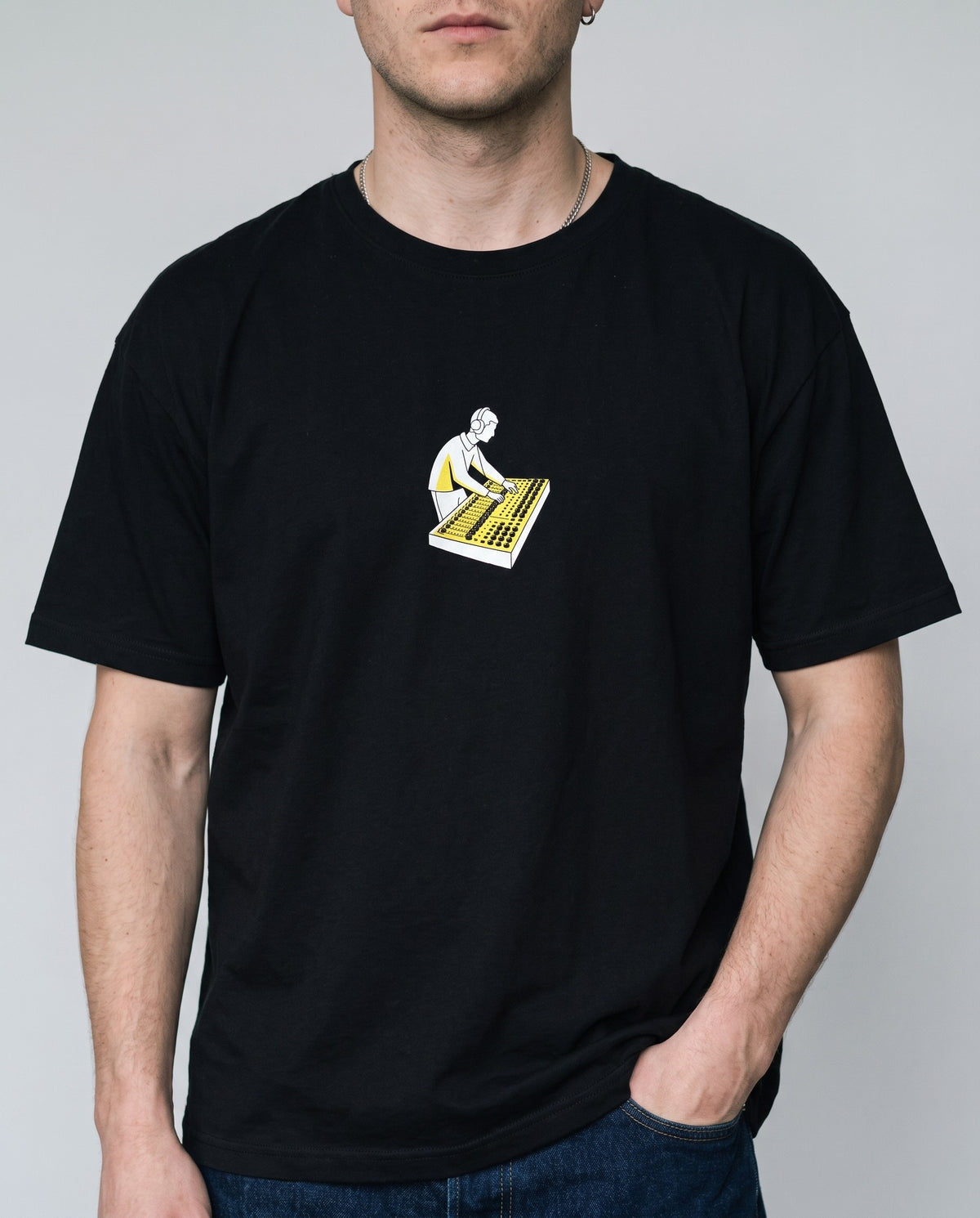 Model wearing the On The Console t-shirt in Black, print close-up