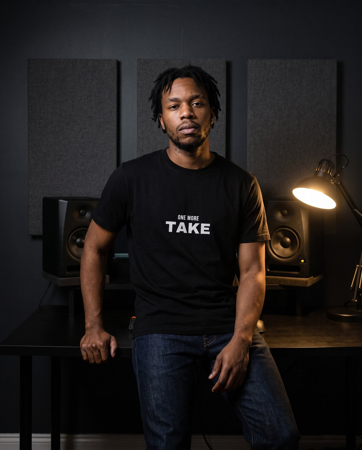 Model wearing the One More Take t-shirt in Black, in a home studio