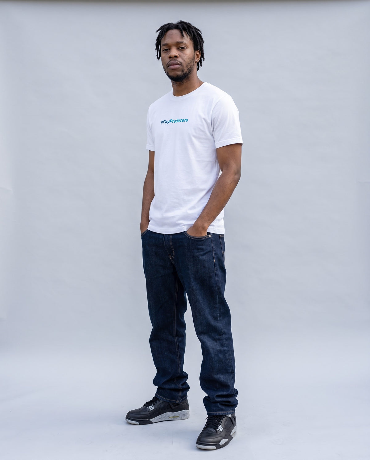 Model wearing the Pay Producer t-shirt in White, full length