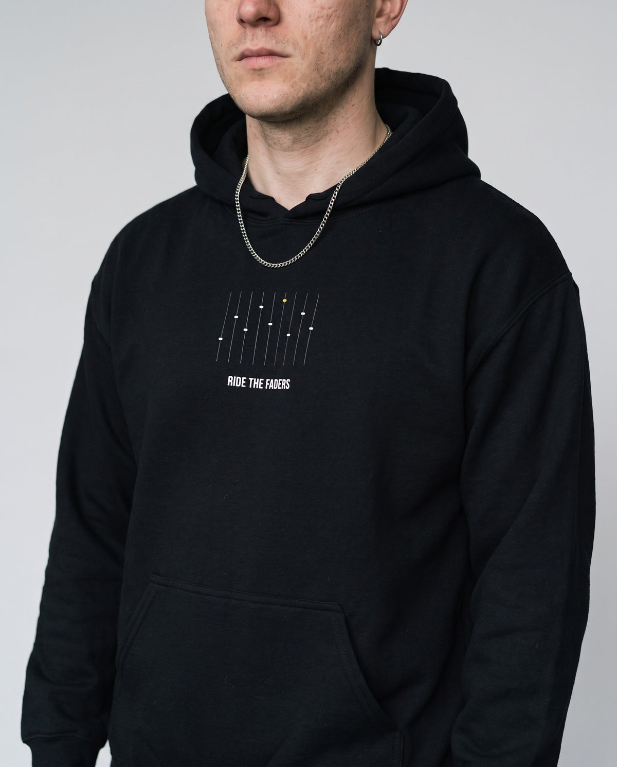 Model wearing the Ride The Faders hoodie in Black, print close-up