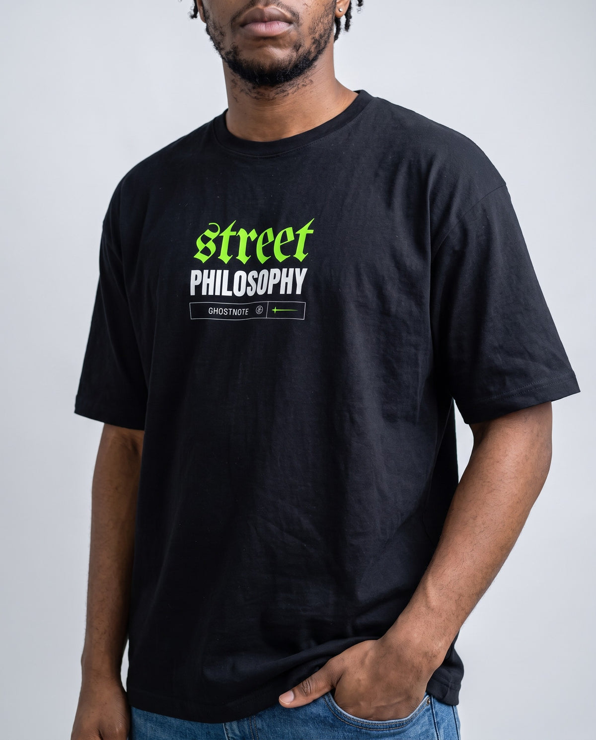 Model wearing the Street Philosophy t-shirt in Black, print close-up