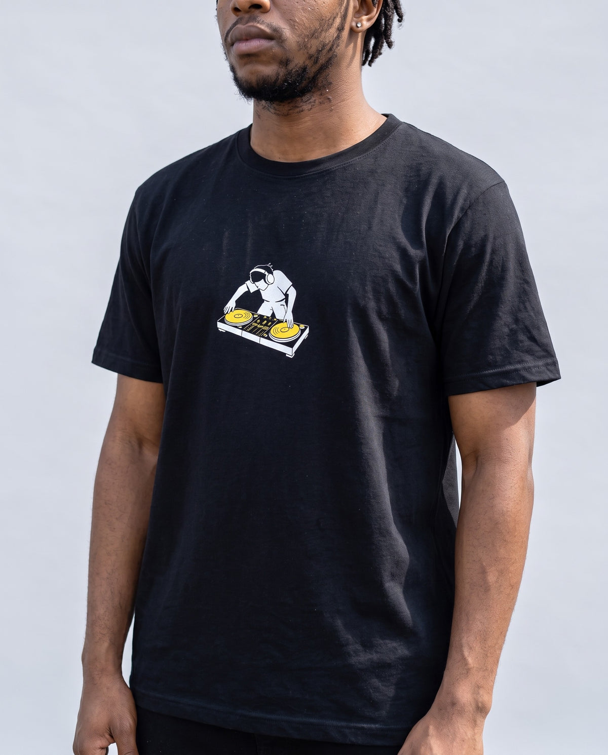 Model wearing the Turntablist t-shirt in Black, print close-up