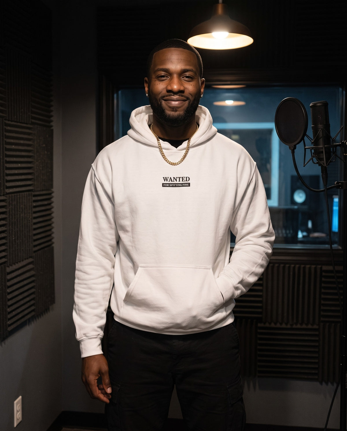 Model wearing the Wanted For Spitting Fire hoodie in White, in a vocal booth